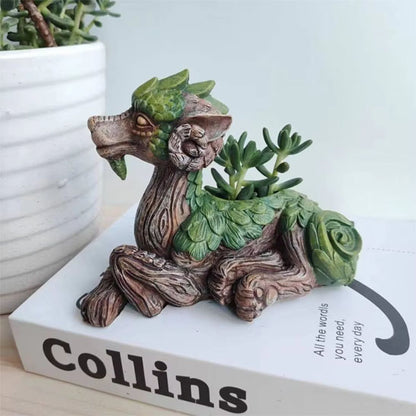 Pot de fleurs intérieur MiniDragon posé sur un livre